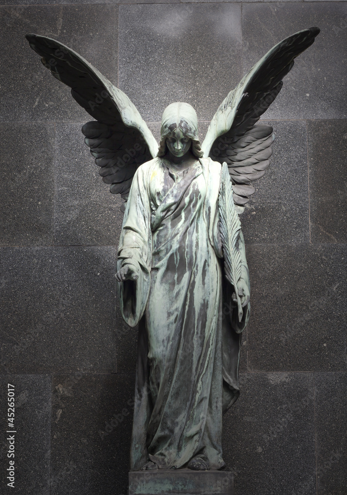 Monument of old angel on cemetery in Warsaw - obrazy, fototapety, plakaty 
