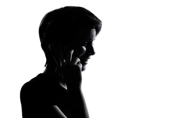 one young teenager boy or girl on the telephone silhouette