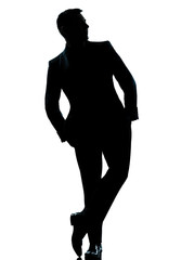 Wall Mural - one business man standing Full length hands in pocket silhouette