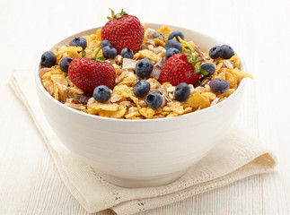 Wall Mural - Bowl of healthy muesli and fresh berries