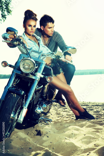 Fototapeta do kuchni Happy young love couple on scooter enjoying - travel