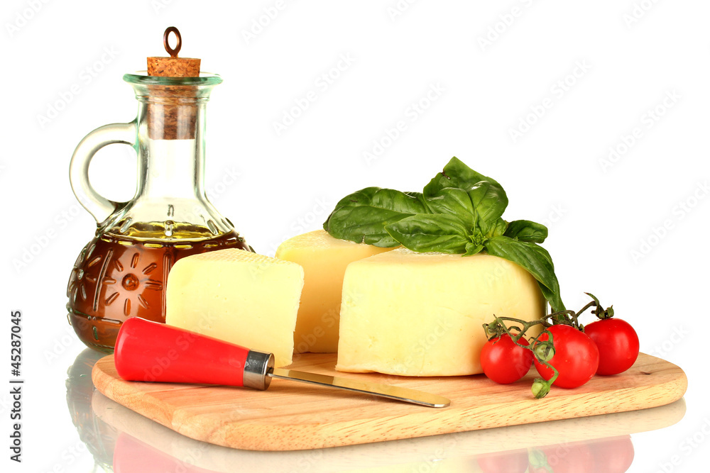 sliced mozzarella cheese with vegetables isolated on white