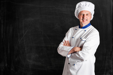 Chef in front of an empty blackboard