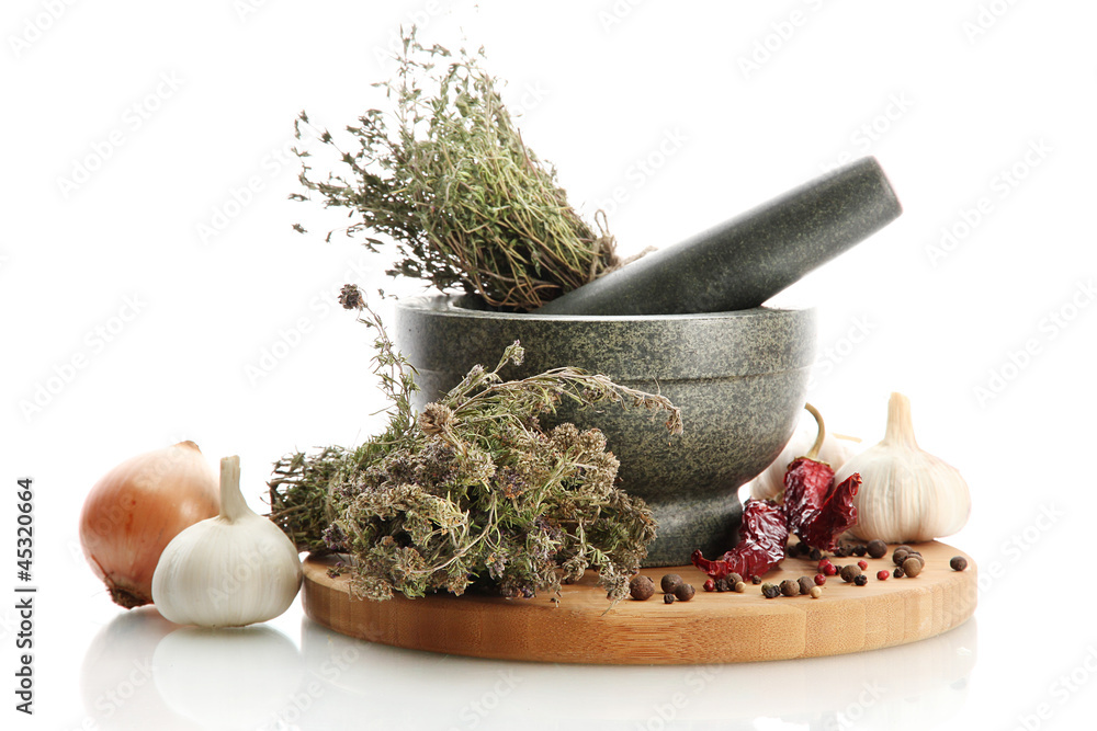 dried herbs in mortar and vegetables, isolatrd on white