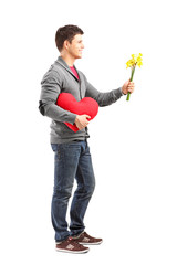 Sticker - Young man holding a heart shaped object and flowers