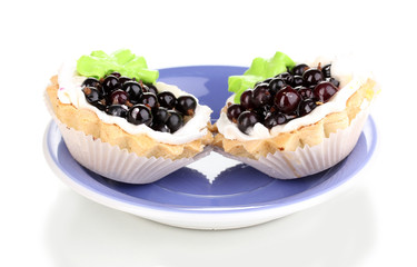 sweet cakes with berries on saucer isolated on white