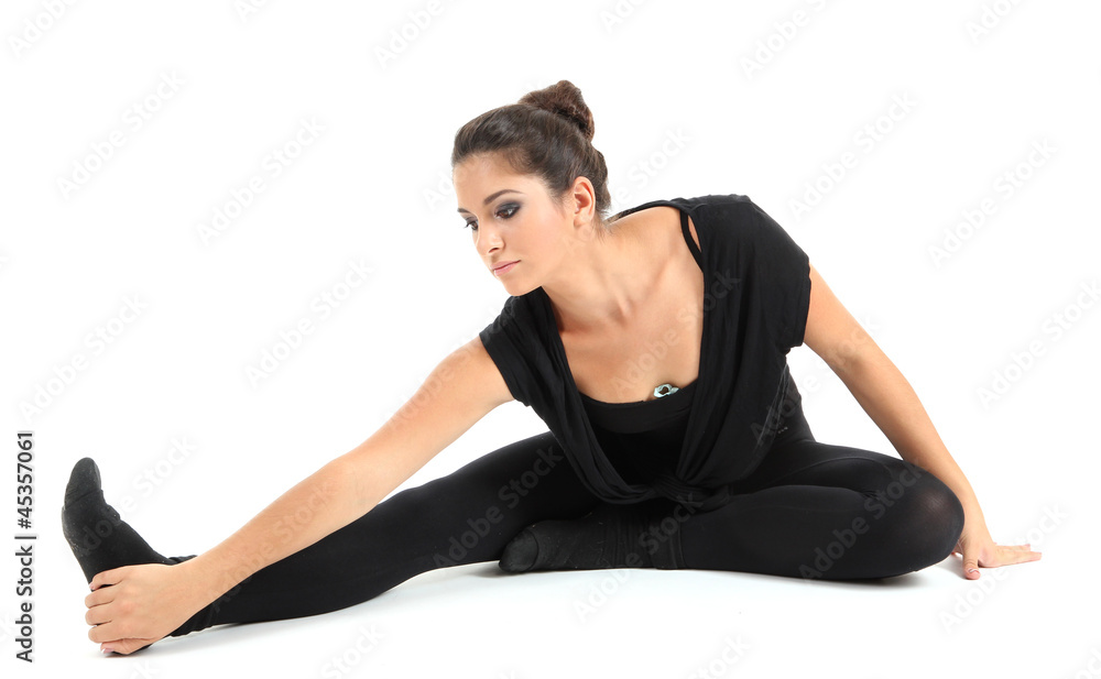 young beautiful brunette warming-up isolated on white