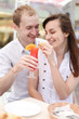 © Smart Future - Young couple drinking juice in cafe