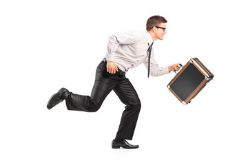 Young businessman running with a briefcase