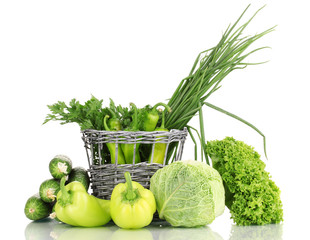 Fototapete - fresh green vegetables in basket isolated on white