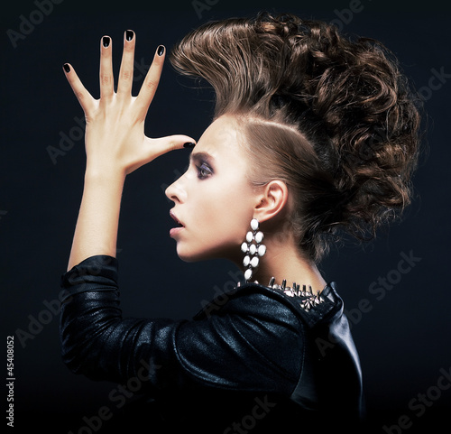 Fototapeta na wymiar Beauty woman with pigtails, creative hairstyle, saluting