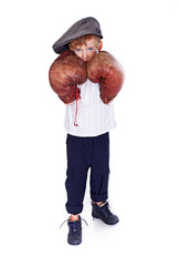 Portrait of little boy posing on white background with boxing gl