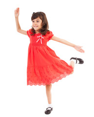 Happy little girl playing in studio