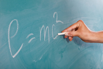 Einstein's Formula E=mc2 on a blackboard