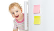 © Andrey Kuzmin - happy child hiding behind fridge door