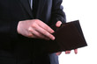 Businessman well-dressed looking for money in the wallet