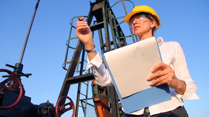 Wall Mural - Female Engineer in an Oilfield