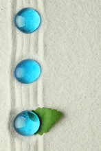 Blue Glass Stones In Sand