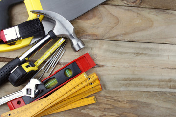 Poster - Assorted carpentry work tools on wooden table. Copy space