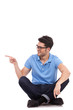 © Viorel Sima - young man sitting and pointing sideways
