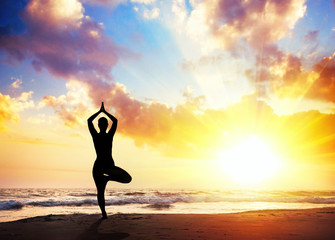 Yoga silhouette on the beach