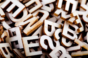 Jumbled wooden letters close up