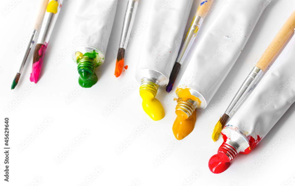 Abstract acrylic paint, paint tubes and brushes isolated