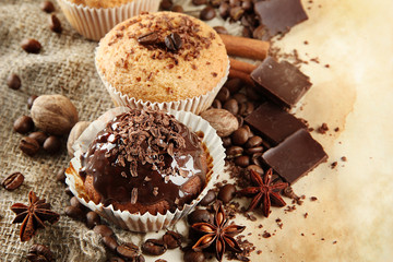 Wall Mural - tasty muffin cakes with chocolate, spices and coffee seeds,