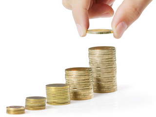 businessman hand coins in finger and row stacks them