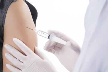 Doctor / Nurse holding a syringe give an injection