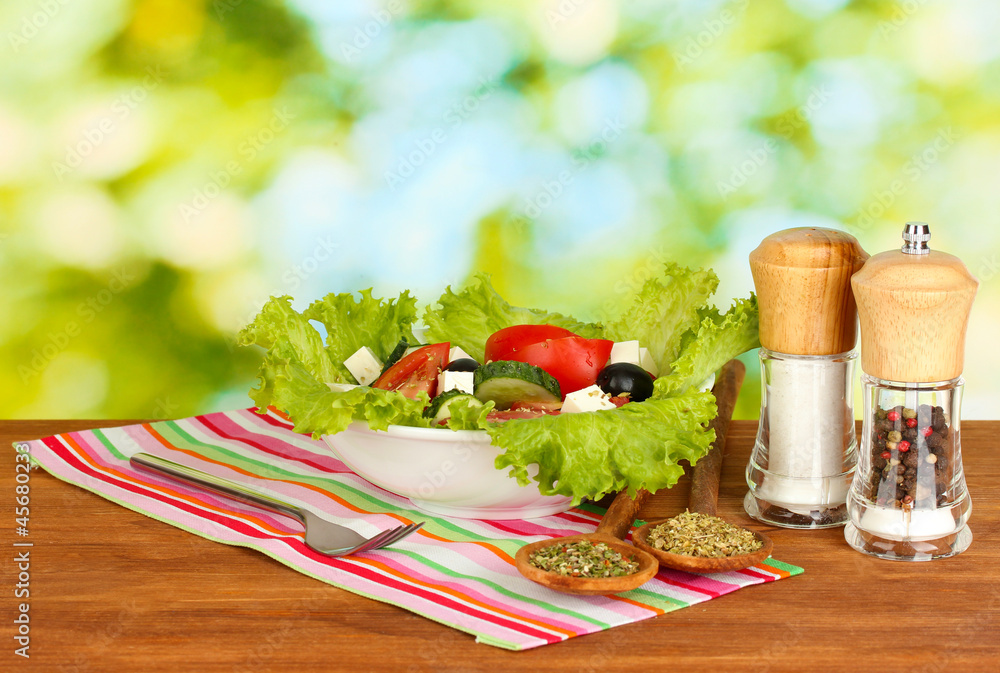 tasty greek salad on bright green background