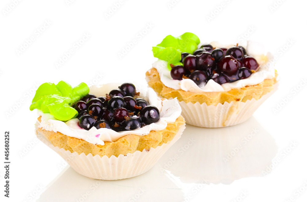 sweet cakes with berries isolated on white