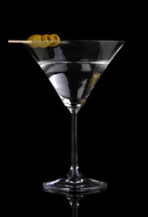 Wall Mural - Martini glass and olives isolated on black