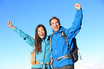 Wall Mural - Happy hiking couple cheering