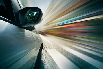 Car driving in city, blurred motion background.