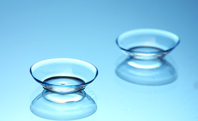 Wall Mural - contact lenses, on blue background