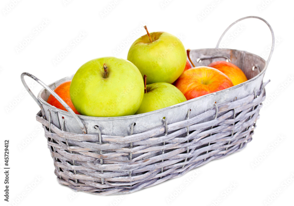 Ripe apples in basket isolated on white