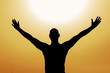 Man saluting the sun with passion for life