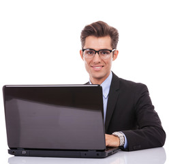 Wall Mural - Business man at his desk with a laptop