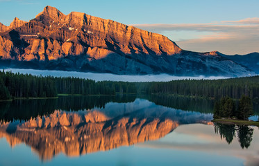 Fotomurali - Orange Mountain Reflection in Lake Minnewanka