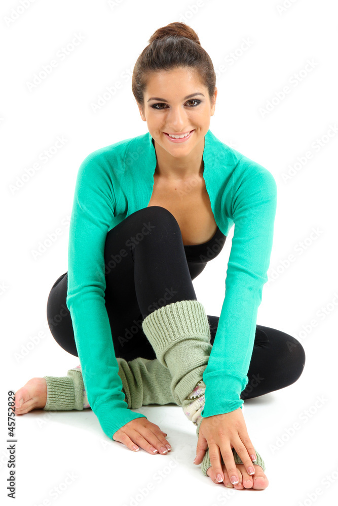 young beautiful brunette warming-up isolated on white