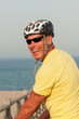 Smiling man wearing a cycling helmet