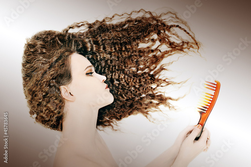 Curly Woman Combing Hair Brunette Comb Wavy Hairstyle Buy This