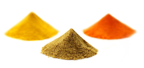 Poster - Ground spices over white background