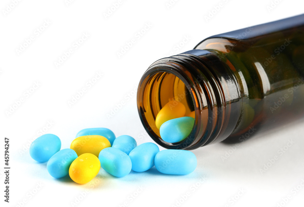 Capsules  in bottle, isolated on white