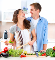 Happy Couple Cooking Together. Dieting. Healthy Food