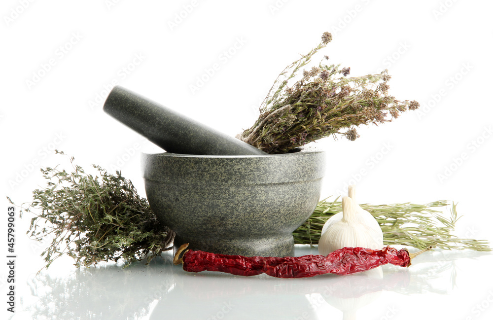 dried herbs in mortar and vegetables, isolatrd on white