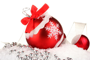 beautiful bright Christmas balls on snow, isolated on white