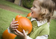 © Andy Dean - Cure Young Child Girl Enjoying the Pumpkin Patch.
