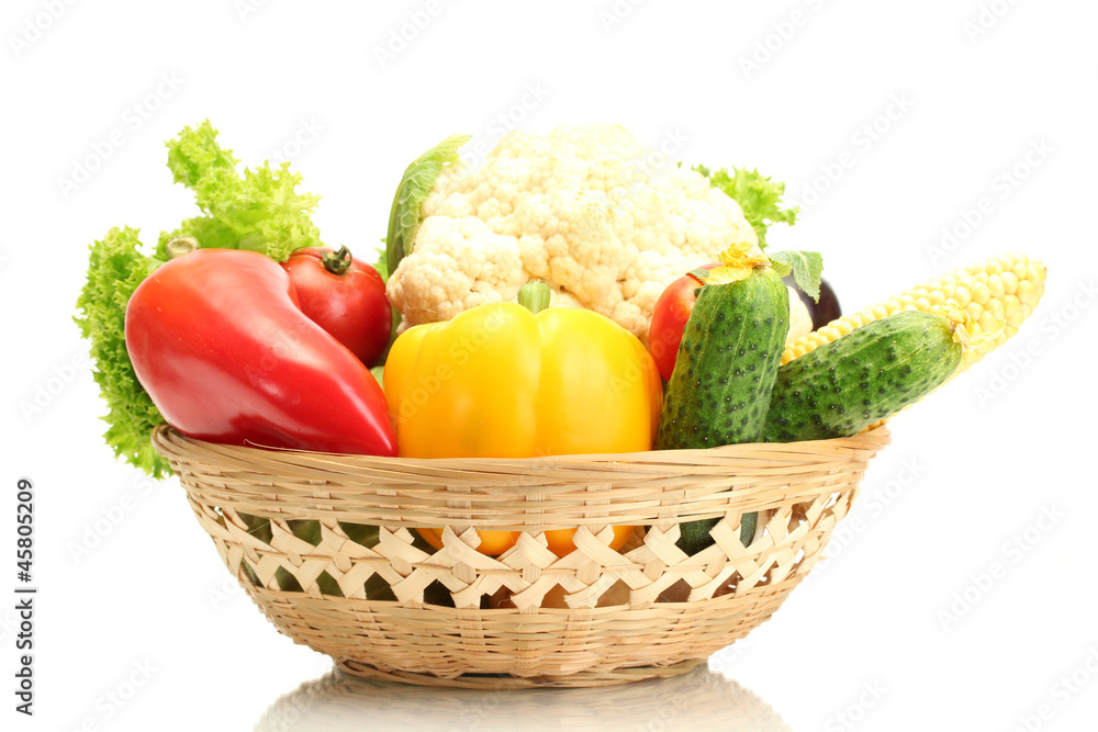Fresh vegetables in basket isolated on white